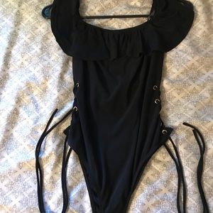 Black One Piece Wit open up tie strings.